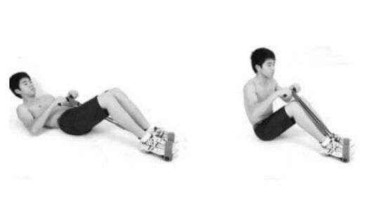 On breathing simultaneously lifting the upper body and bending the legs on the knees